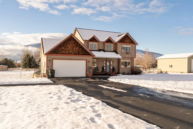 view of front of home featuring a garage and aphalt driveway