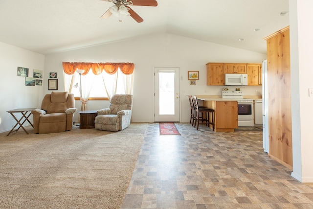 living area with vaulted ceiling, plenty of natural light, baseboards, and ceiling fan