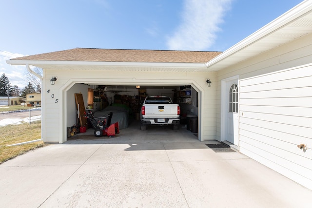 garage featuring driveway