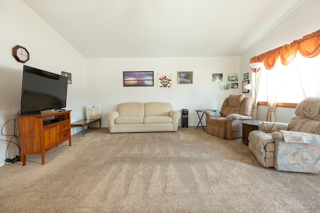 carpeted living room featuring lofted ceiling