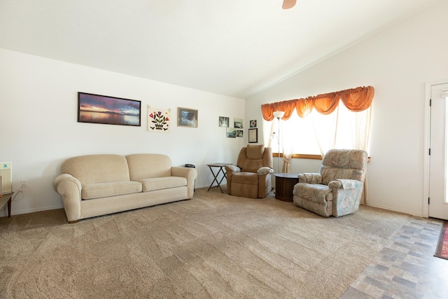 living area with vaulted ceiling and carpet flooring