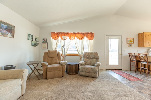 living area with vaulted ceiling