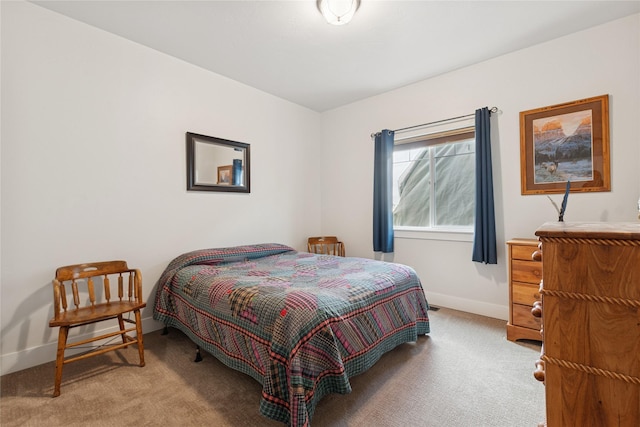 carpeted bedroom with baseboards