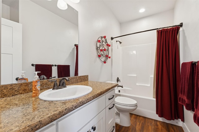 full bathroom with toilet, recessed lighting, wood finished floors, vanity, and shower / bath combination with curtain