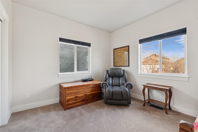 sitting room featuring carpet, visible vents, and baseboards