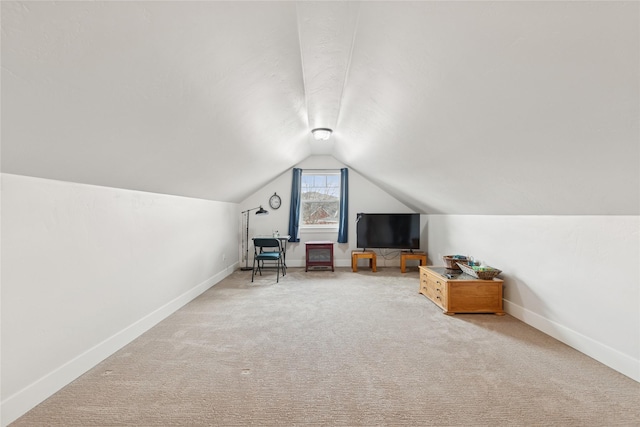 bonus room with lofted ceiling, carpet flooring, and baseboards