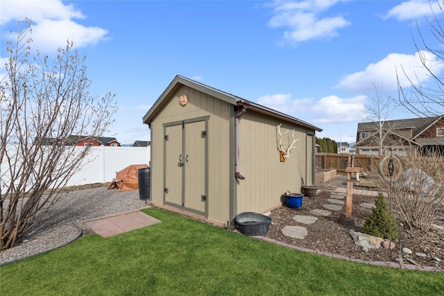 view of shed featuring a fenced backyard