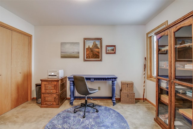 office space featuring carpet flooring and baseboards