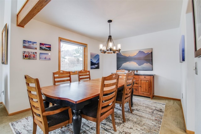 dining room featuring light carpet, baseboards, beam ceiling, and an inviting chandelier