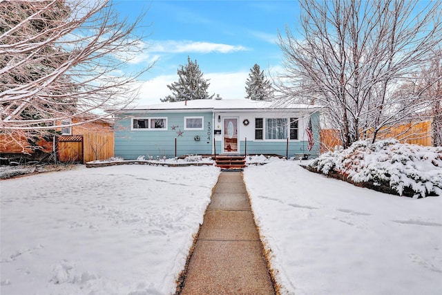 view of front of house featuring fence