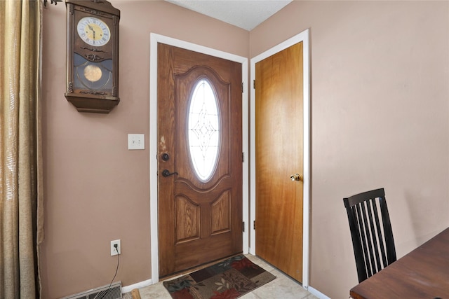 foyer featuring visible vents