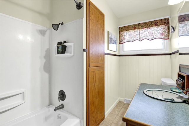 full bath featuring washtub / shower combination, tile patterned flooring, visible vents, and vanity