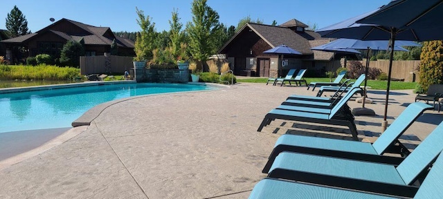 view of pool featuring a fenced in pool, a patio area, and fence