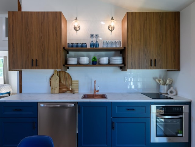 kitchen with light stone counters, open shelves, a sink, stainless steel appliances, and tasteful backsplash