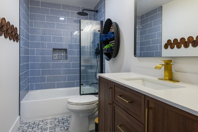 full bathroom featuring tile patterned floors, washtub / shower combination, toilet, and vanity