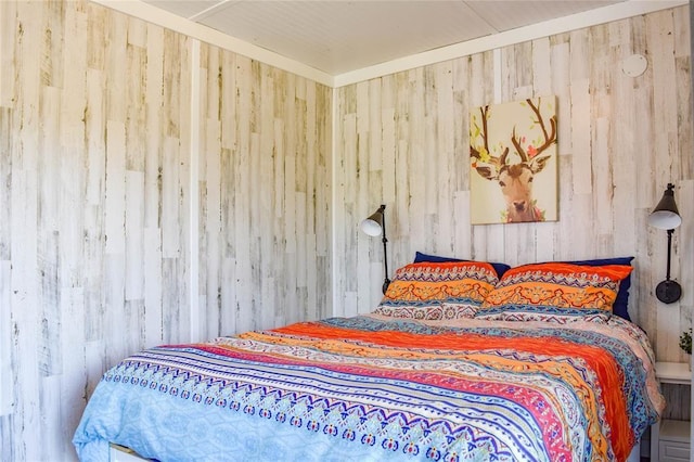 bedroom with wooden walls