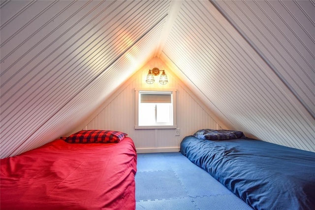 bedroom with carpet and lofted ceiling