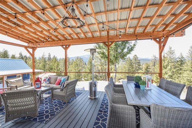 deck with outdoor dining space and outdoor lounge area