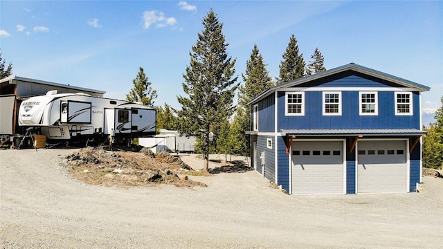 exterior space featuring dirt driveway