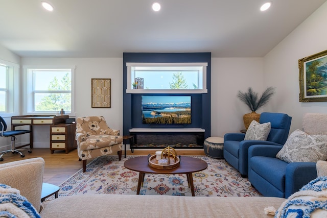 living area with recessed lighting and wood finished floors