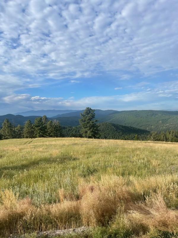 property view of mountains featuring a rural view