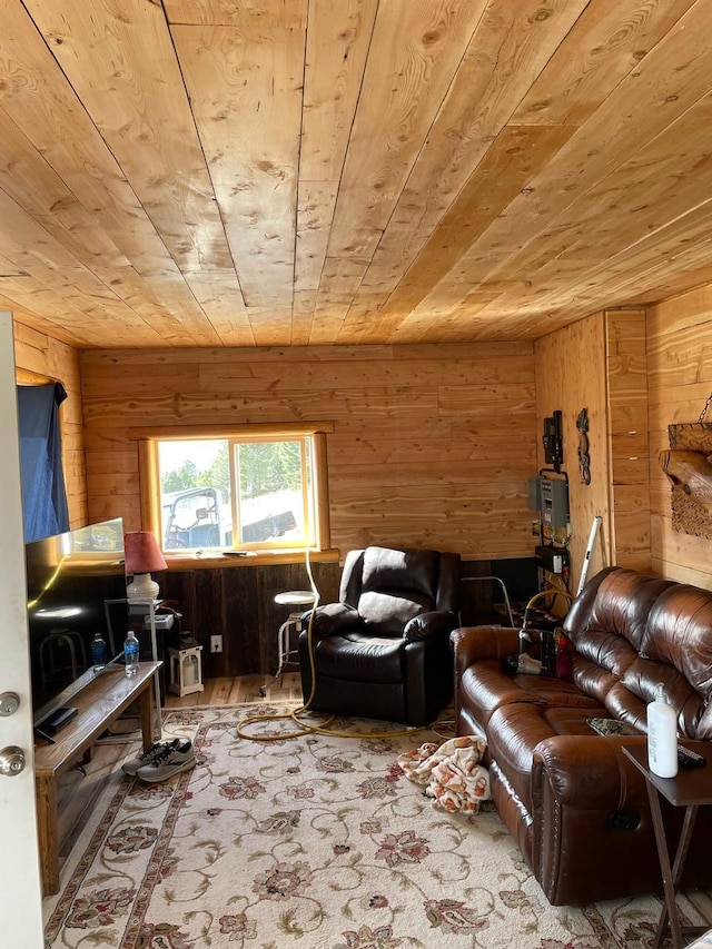 living area featuring wooden ceiling, wooden walls, and wood finished floors