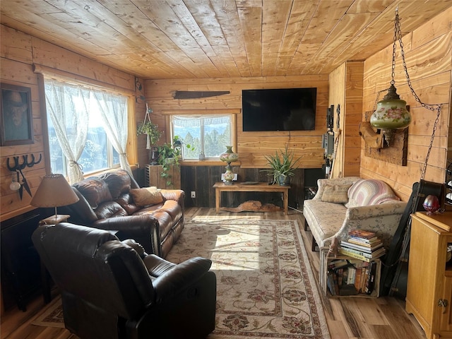 living area featuring wood finished floors, wood ceiling, and wood walls