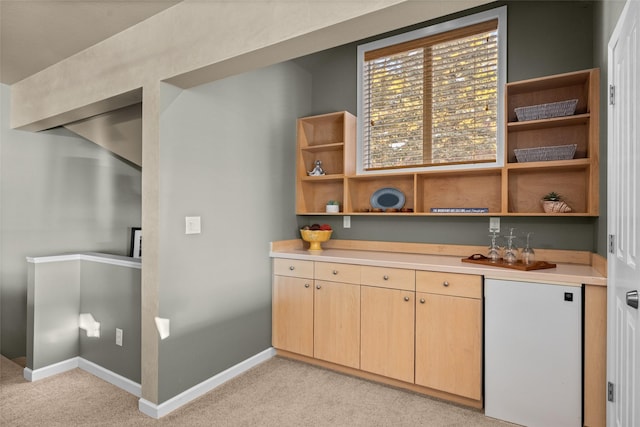 bar with light carpet, baseboards, and refrigerator