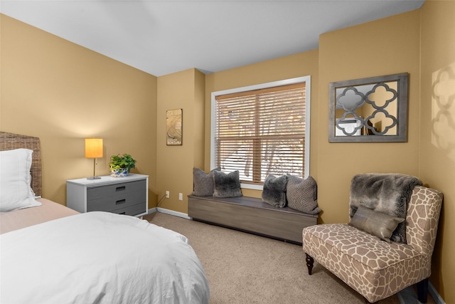 bedroom featuring carpet floors and baseboards