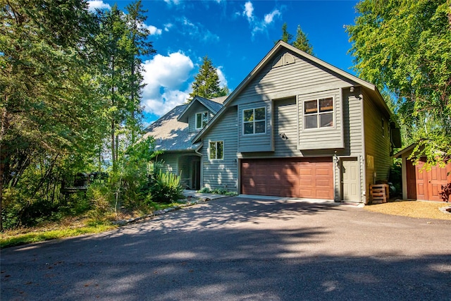 view of front of home featuring a garage and driveway