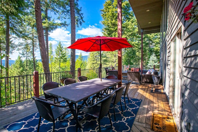 deck featuring outdoor dining area