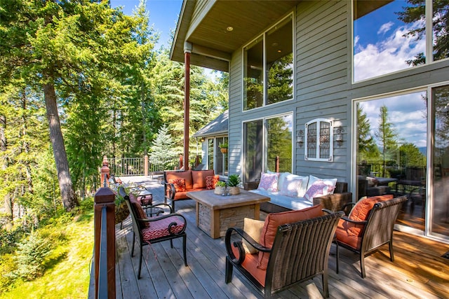 wooden terrace featuring an outdoor hangout area