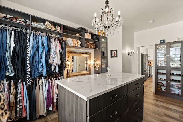 spacious closet with wood finished floors