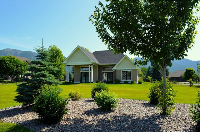 1228 Quail Ridge Dr, Kalispell, MT 59901 - view of front of property with a front yard and a mountain view