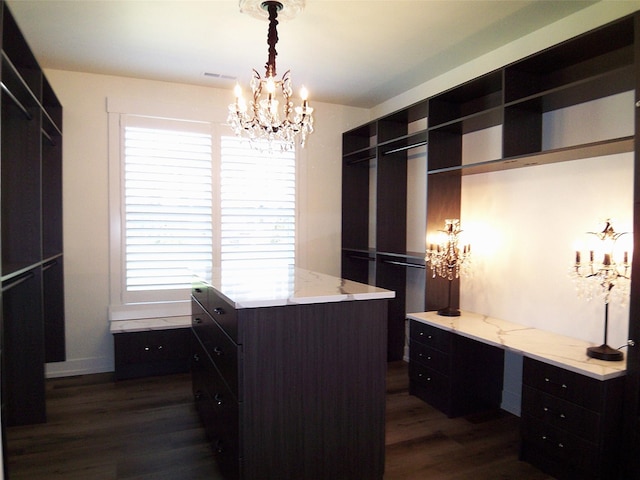 1228 Quail Ridge Dr, Kalispell, MT 59901 - walk in closet with a chandelier and dark wood finished floors