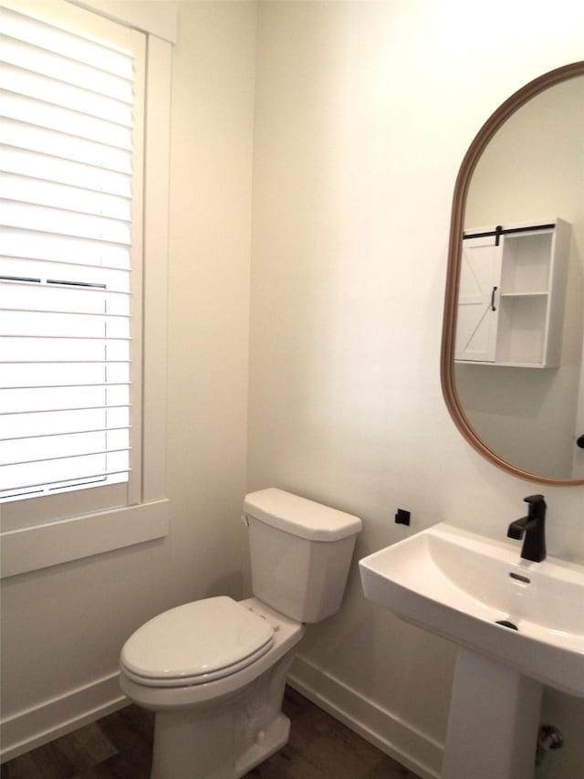 1228 Quail Ridge Dr, Kalispell, MT 59901 - bathroom featuring wood finished floors and toilet