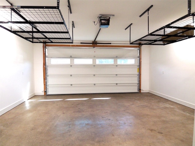 1228 Quail Ridge Dr, Kalispell, MT 59901 - garage featuring baseboards and a garage door opener