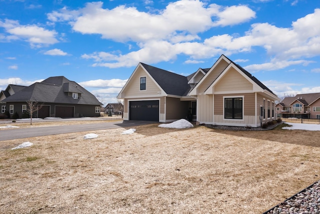 view of front of house with board and batten siding and a garage