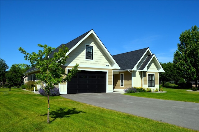 1228 Quail Ridge Dr, Kalispell, MT 59901 - modern inspired farmhouse with asphalt driveway, a front yard, and roof with shingles