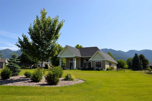 1228 Quail Ridge Dr, Kalispell, MT 59901 - view of front of house featuring a front yard and a mountain view