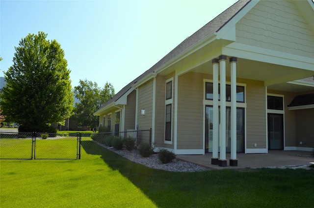 1228 Quail Ridge Dr, Kalispell, MT 59901 - view of side of property with a patio and a shingled roof