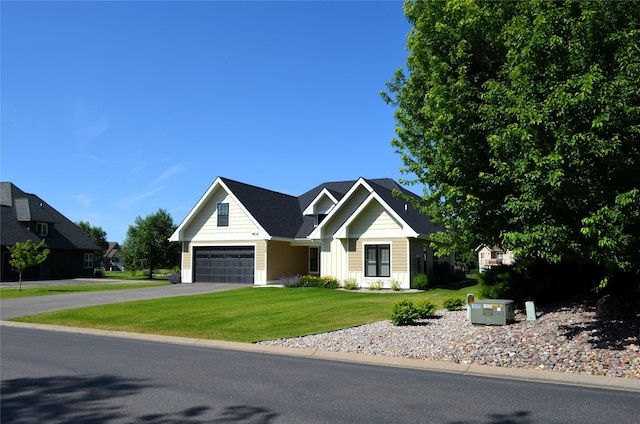 1228 Quail Ridge Dr, Kalispell, MT 59901 - view of front of property with a front yard, driveway, and a garage