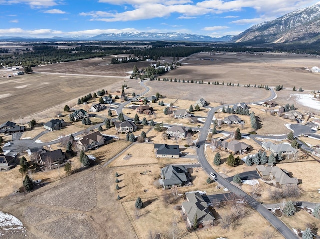 drone / aerial view with a residential view and a mountain view