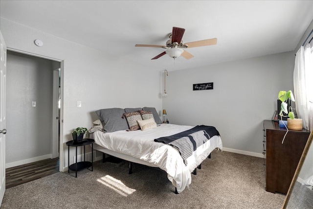 bedroom featuring a ceiling fan, carpet floors, and baseboards