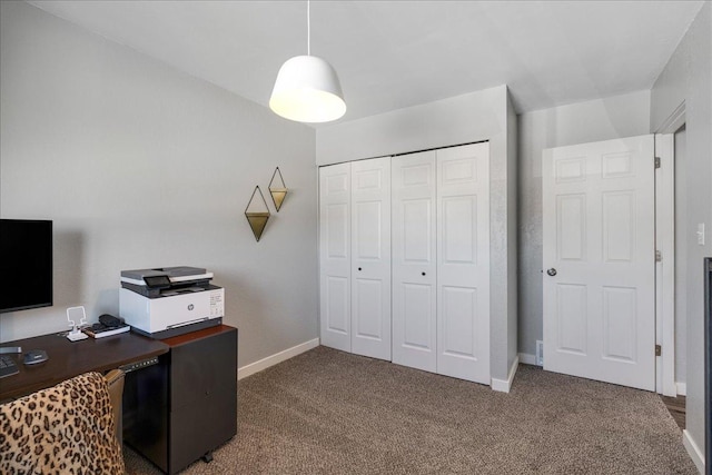 home office featuring carpet and baseboards