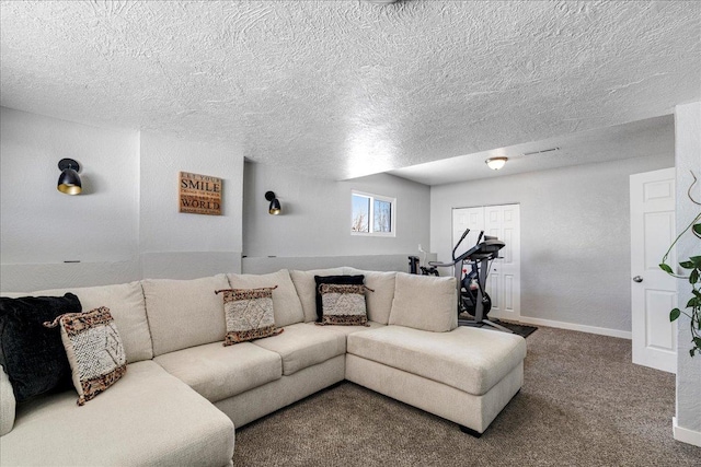 carpeted living area with baseboards and a textured ceiling