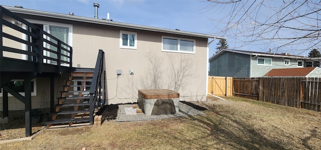 back of house with fence and stairway