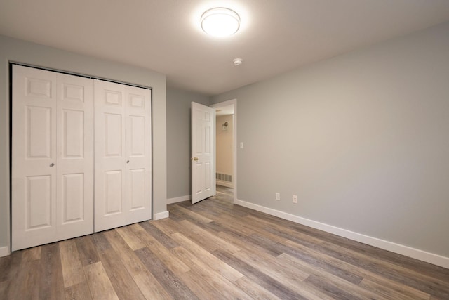 1949 University St, Helena, MT 59601 - unfurnished bedroom with wood finished floors and a closet
