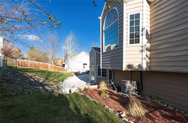 1949 University St, Helena, MT 59601 - view of side of home featuring a patio area and a central air condition unit