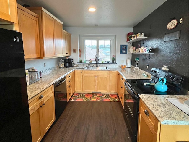 kitchen featuring dark wood-style flooring, light stone countertops, black appliances, open shelves, and a sink